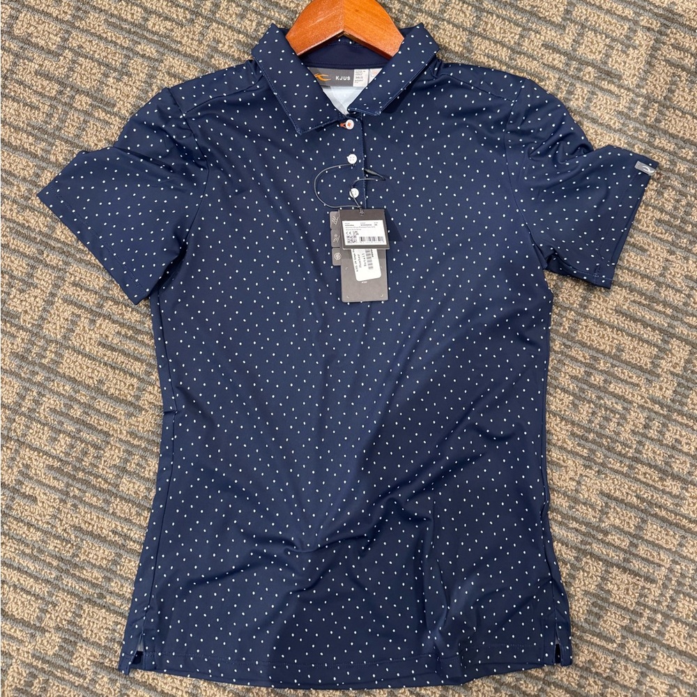 KJUS women’s golf polo. Blue polka dots. Poly. Multiple sizes.